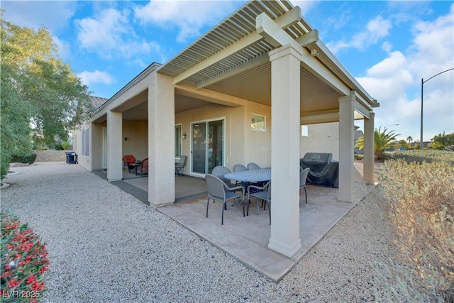 back of house with a patio area and a pergola