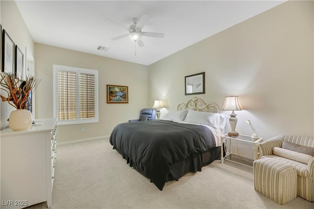 bedroom with ceiling fan and light carpet