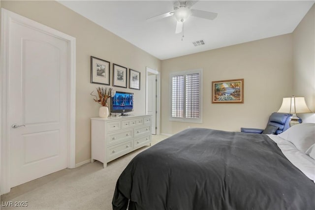 bedroom with ceiling fan and light colored carpet