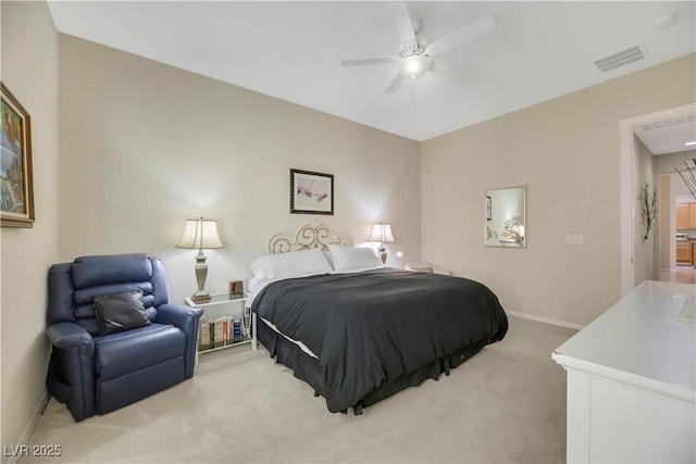 bedroom featuring ceiling fan and light colored carpet