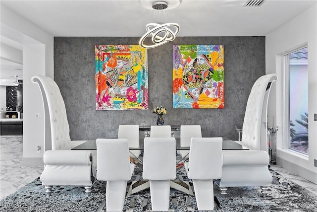 dining space with a chandelier