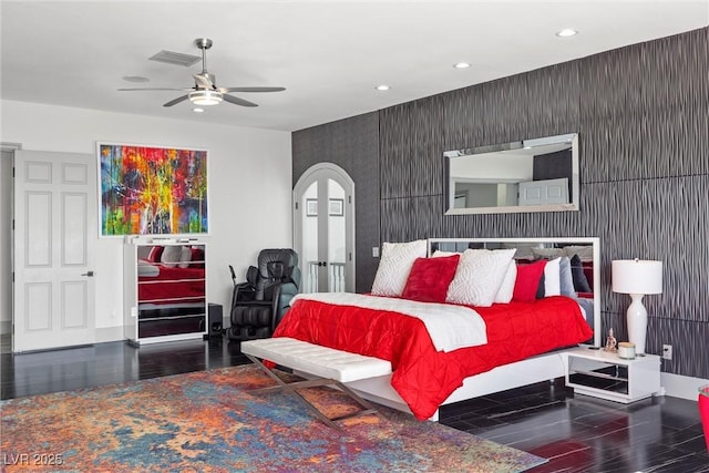 bedroom with ceiling fan and dark hardwood / wood-style flooring