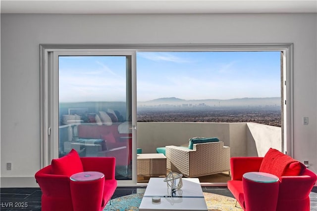 interior space with a mountain view and a balcony