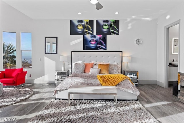 bedroom with ceiling fan and wood-type flooring