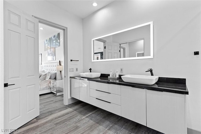 bathroom with vanity and hardwood / wood-style floors