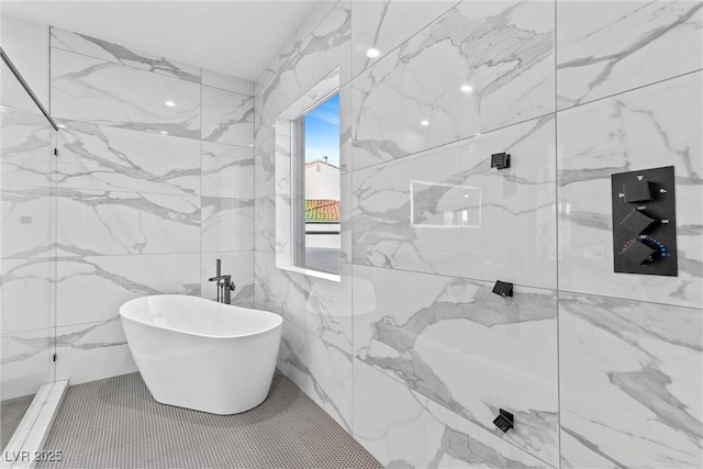 bathroom featuring independent shower and bath and tile walls