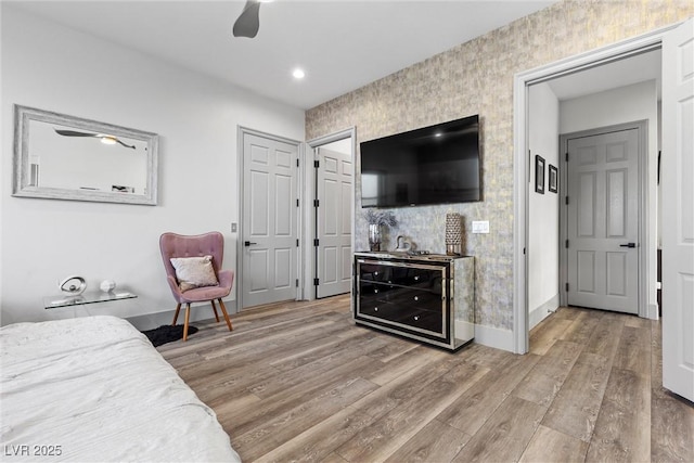 bedroom featuring ceiling fan and light wood-type flooring