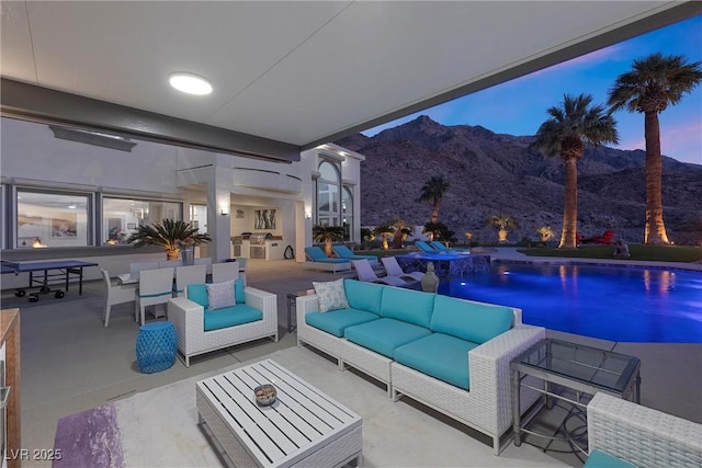 pool at dusk with a mountain view