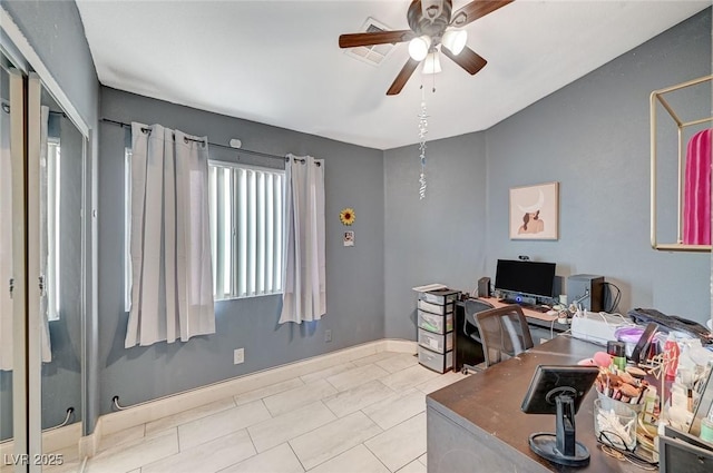 office space with light tile patterned floors and ceiling fan