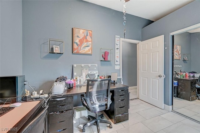 office area with light tile patterned floors