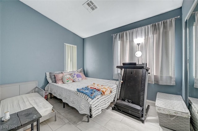 bedroom with lofted ceiling