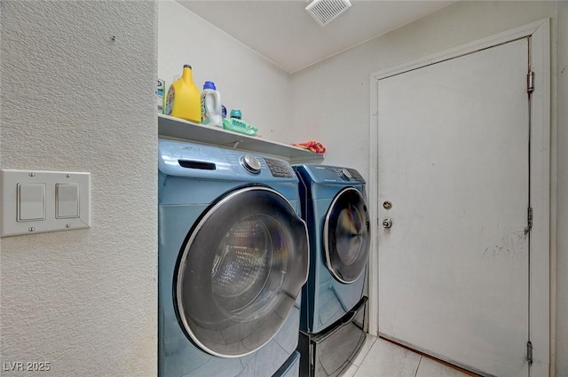 laundry area featuring washing machine and dryer