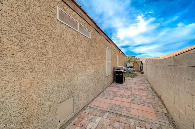 view of home's exterior with a patio area