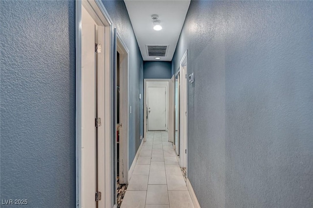 hallway with light tile patterned flooring