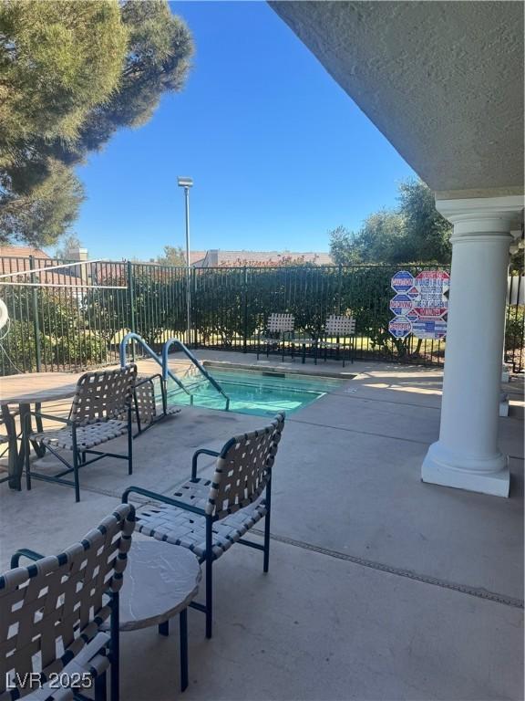 view of swimming pool featuring a patio