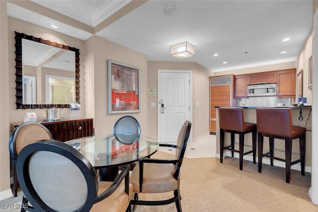 dining area featuring ornamental molding