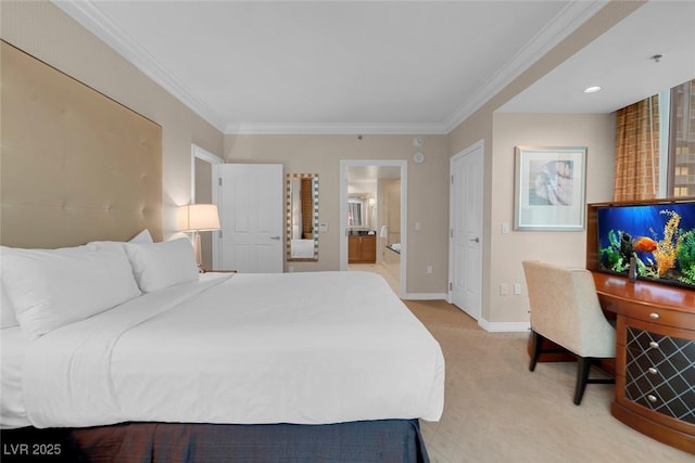 bedroom featuring ornamental molding, connected bathroom, and light colored carpet