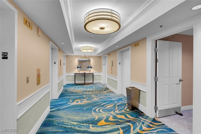 hallway featuring elevator, ornamental molding, and light tile patterned floors