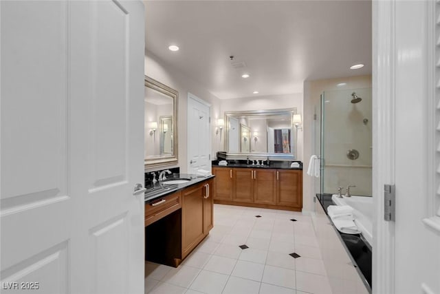 bathroom featuring vanity, tile patterned flooring, and separate shower and tub