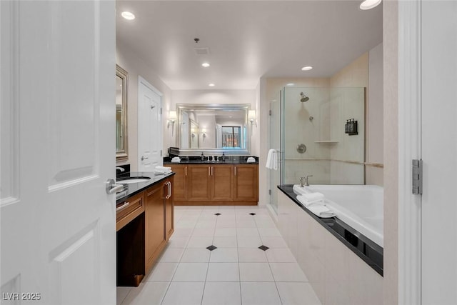 bathroom featuring vanity, separate shower and tub, and tile patterned floors