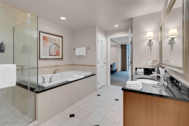 bathroom featuring tile patterned floors, vanity, and plus walk in shower