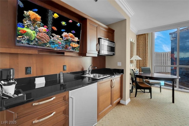 kitchen featuring sink and crown molding