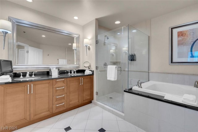 bathroom featuring vanity, tile patterned floors, and shower with separate bathtub