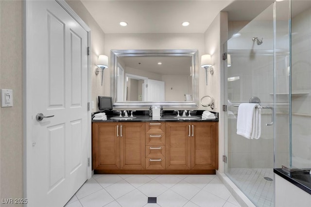 bathroom featuring vanity, tile patterned floors, and walk in shower