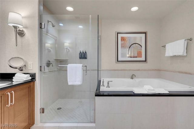 bathroom with vanity and plus walk in shower