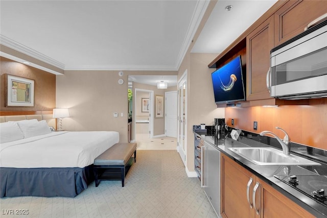 bedroom featuring sink and crown molding