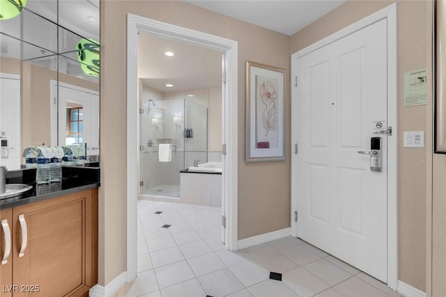 tiled entryway featuring sink