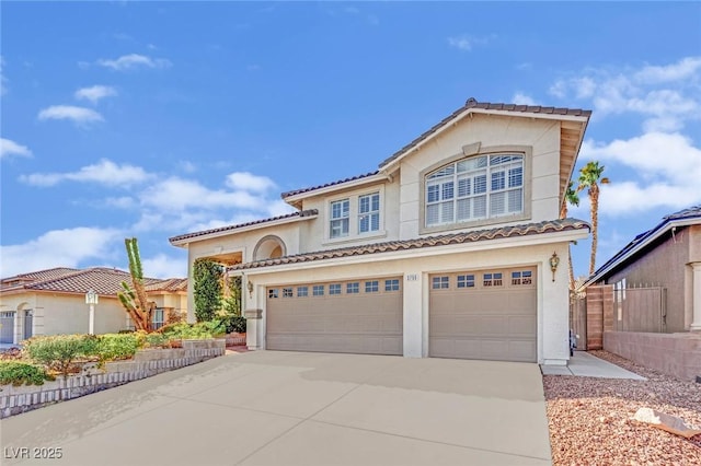 mediterranean / spanish-style home featuring a garage