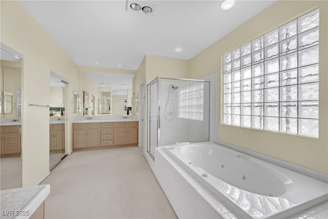 bathroom featuring independent shower and bath and vanity