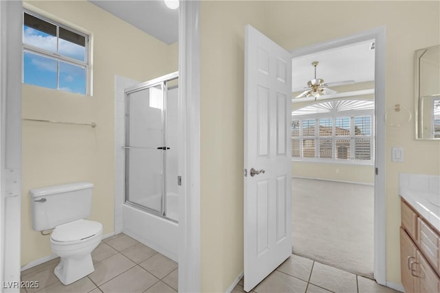 full bathroom with toilet, vanity, enclosed tub / shower combo, a healthy amount of sunlight, and tile patterned flooring