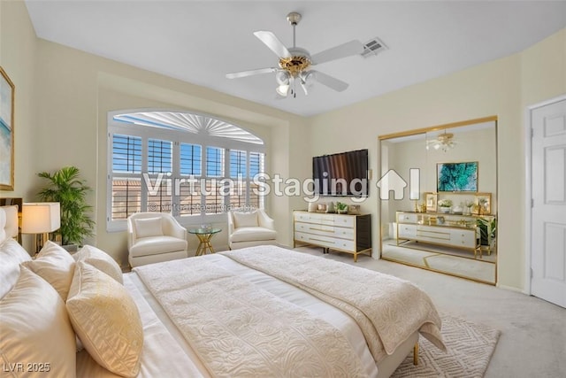 bedroom featuring light colored carpet and ceiling fan