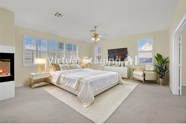 carpeted bedroom featuring ceiling fan