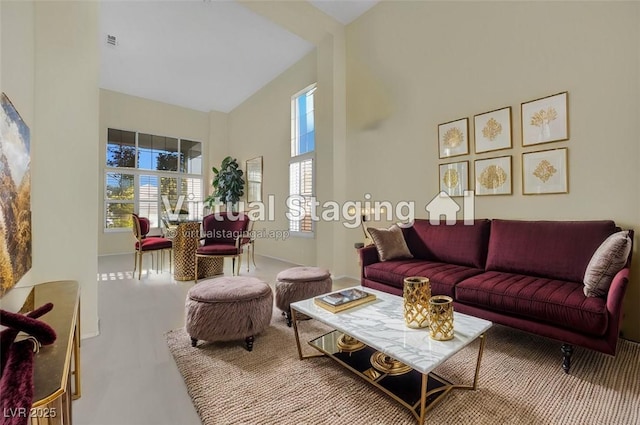 living room with a towering ceiling