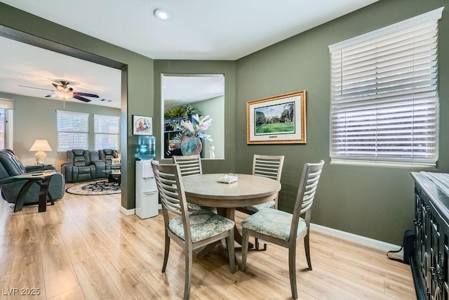 dining area featuring ceiling fan and light wood-type flooring