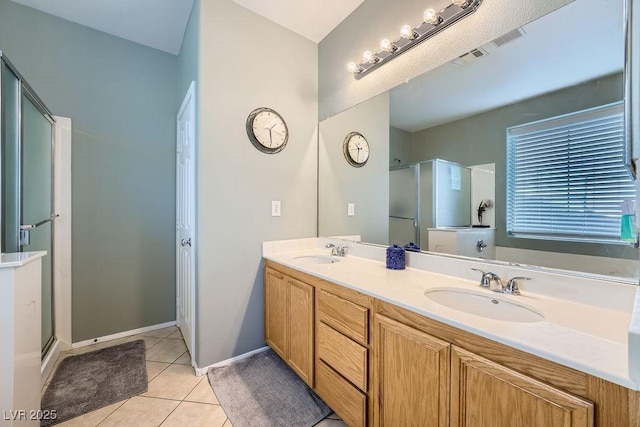 bathroom with vanity, tile patterned floors, and walk in shower