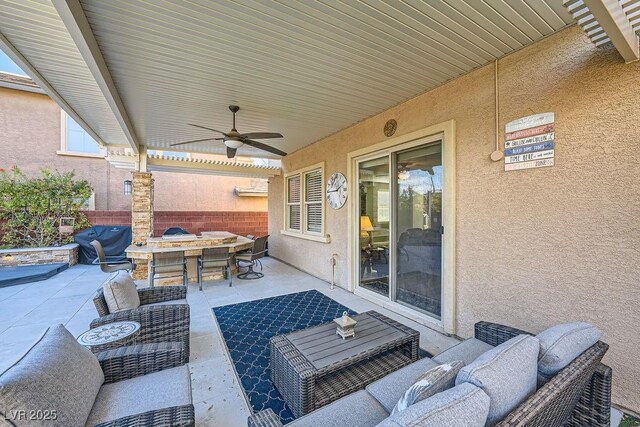 view of patio / terrace featuring ceiling fan, an outdoor living space, and area for grilling