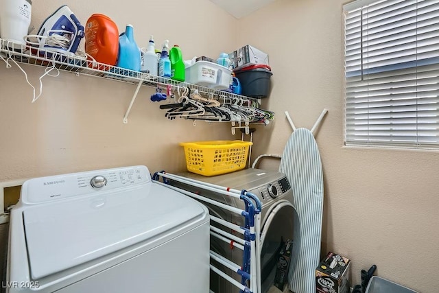 washroom with washing machine and dryer