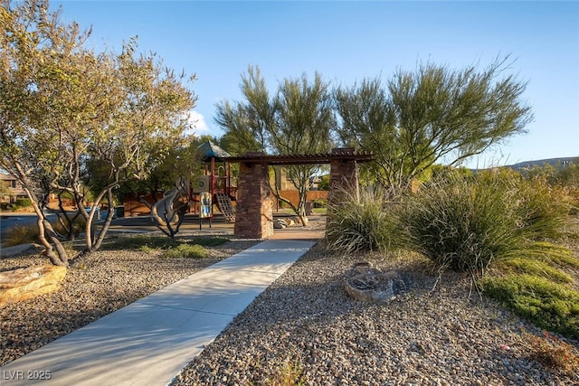 view of home's community featuring a playground