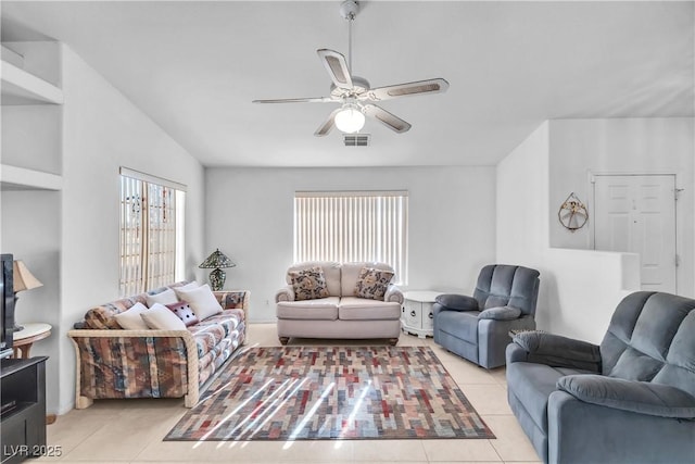 living room with ceiling fan, light tile patterned floors, and plenty of natural light