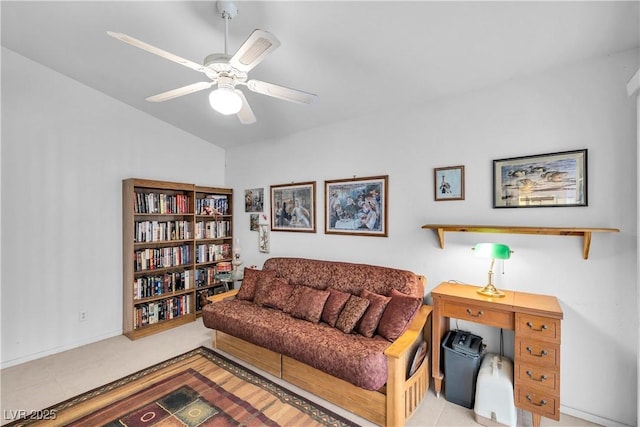 living room featuring ceiling fan and vaulted ceiling