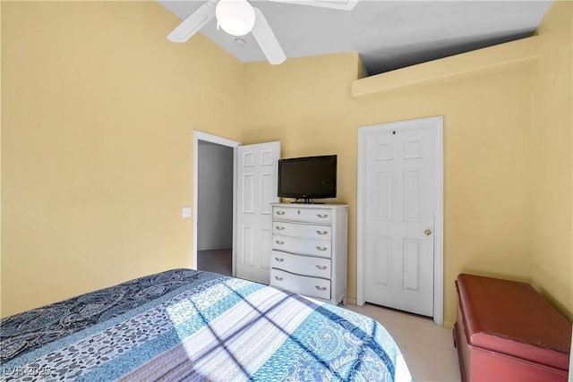 bedroom featuring ceiling fan and vaulted ceiling