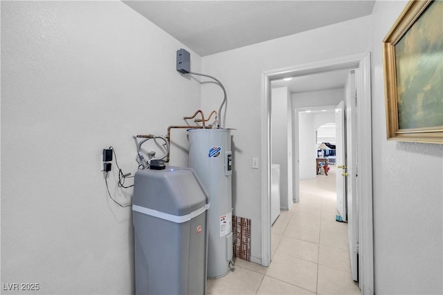 utility room featuring electric water heater