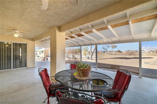 view of patio / terrace featuring ceiling fan