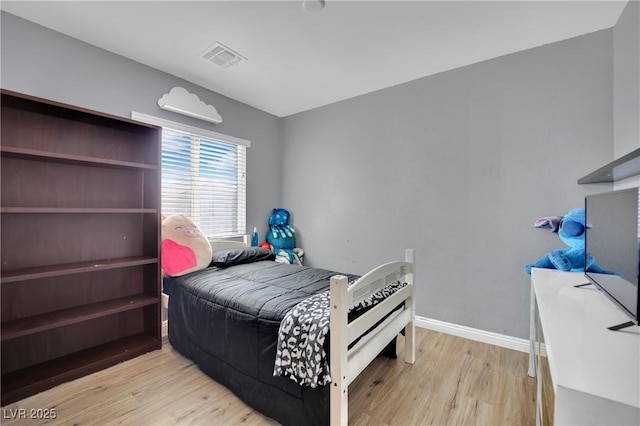 bedroom featuring light wood-type flooring