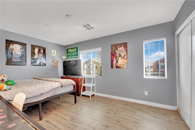 bedroom with light hardwood / wood-style floors