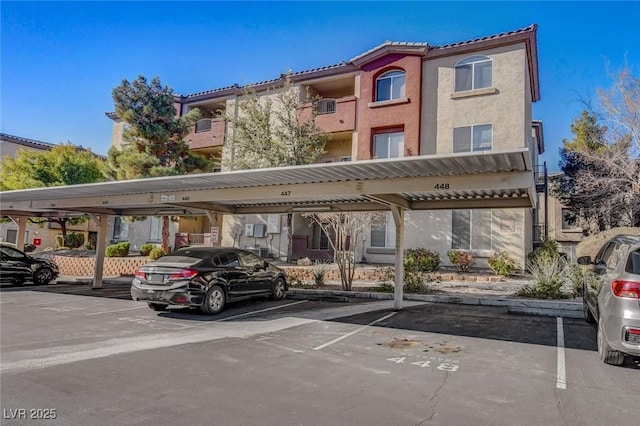 view of vehicle parking featuring a carport